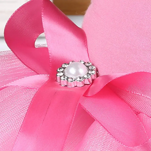 Bow dog dress features satin bow and beading.