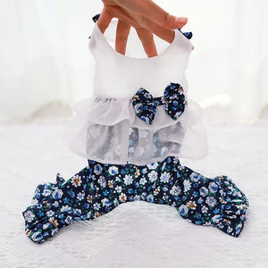 White top with floral pants and a bow on a white background