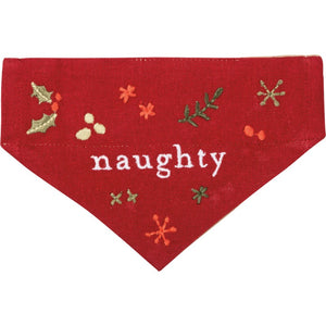 This red Christmas small reversible dog collar bandana features an embroidered "Naughty" sentiment and holiday botanical designs on one side.