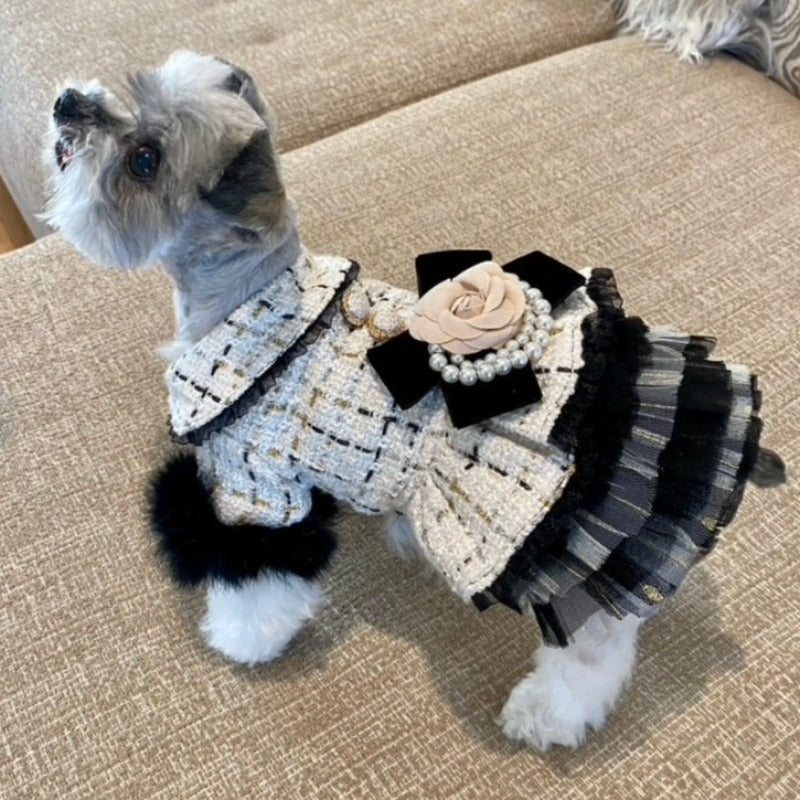 Exquisitely crafted with the finest details, this Handmade Tweed Dog Dress is adorned with black faux fur sleeves, ornate beading, lace and buttons, rose waistline and tulle skirt.