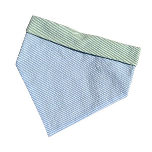 Handmade in the USA by Chloe & Max, this Blue Seersucker Bandana features blue seersucker on green seersucker trim and backing. 