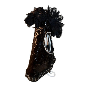 This handmade “Elektra” dress is exquisitely crafted by C’Mimi’s world-renowned pet fashion Designer Jan Ben with the finest details. This luxurious dog dress features glittering black sequins, silver beaded leather trim down the midline and cascading black lace at the neck.