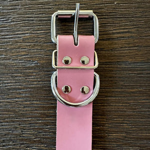 Genuine pink leather collar has a metal buckle.