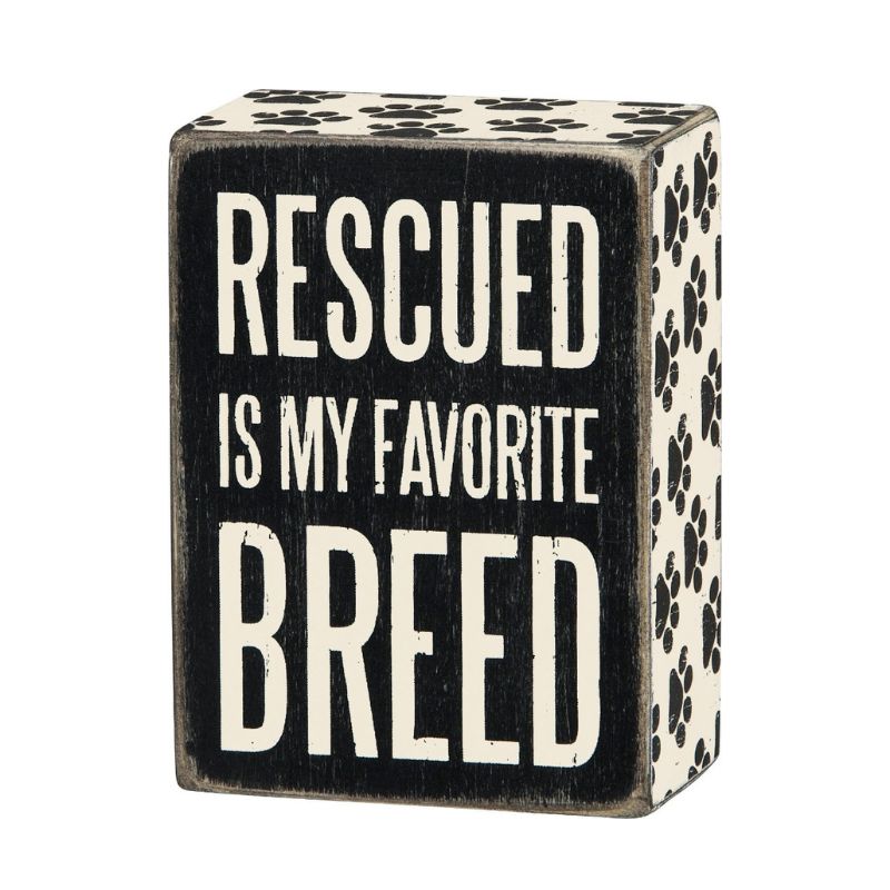 Box Sign - Rescued Is My Favorite Breed, white text on black background with black paw prints on white borders