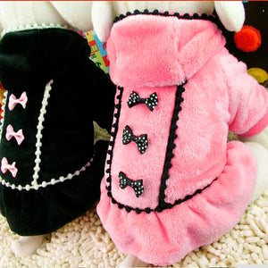 Adorned with polka dot bows, this warm coat is designed for small and medium-sized dogs.