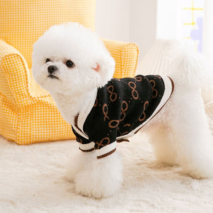 Featuring brown and white trim, and brwon infinity patterns, this elegant dog sweater is perfect for small to medium dogs.
