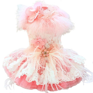 Our handmade Sophia Dog Party Dress is exquisitely crafted with the finest details, including feathers, embroidered floral lace, faux-pearl applique flowers and a tulle skirt.