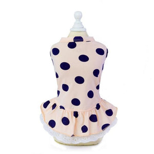 This light pink Pretty Polka Dot Dog Dress is made of cotton and trimmed with lace.