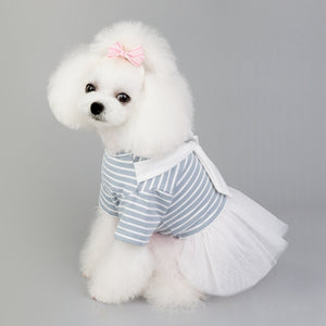 Featuring a bow scarf, striped bodice and white tulle skirt, this cotton dog dress is designed for small dog breeds.