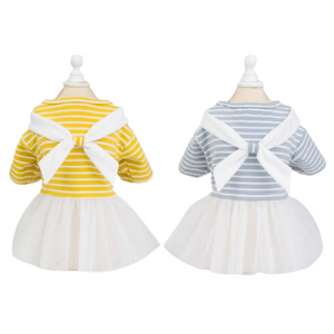 Your pup will be ready to set sail on a doggy adventure in this Striped Sailor Dog Dress, available in yellow or blue.