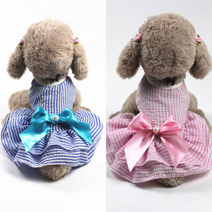 Adorned with a large satin bow with faux pearl and rhinestone detail, this 100% Cotton dog dress is perfect for small to medium breed dogs.