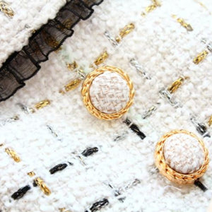 Exquisitely crafted with the finest details, this Handmade Tweed Dog Dress is adorned ornate buttons.
