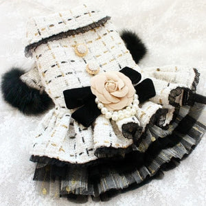 Exquisitely handcrafted with the finest details, this Handmade Tweed Dog Dress is adorned with luxurious touches.