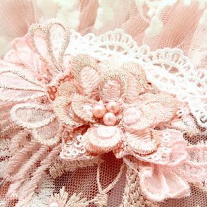 Pink flowers with pink faux pearls adorn the Grace Designer Dog Party Dress.