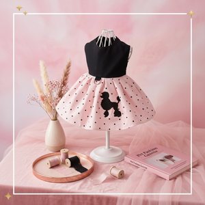 Mannequin wearing a black and pink polka dot dress with a poodle design on a pink background.