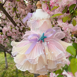 Luxury Handmade Pink Pearl Starfish Dog Party Dress features layered flowing tulle in light pastels, faux pearl beading to look like ocean bublles, a lilac bow and blue starfish on the bow