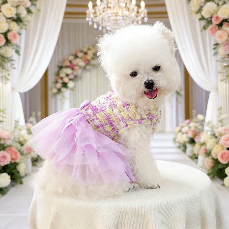Lilac dog party dress pet  with a floral bow on a mannequin against a white background