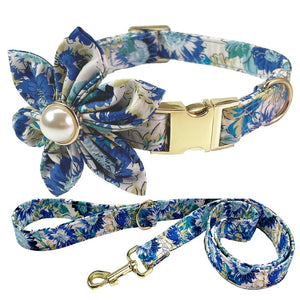 Floral dog collar and leash set with a decorative flower attachment on a white background