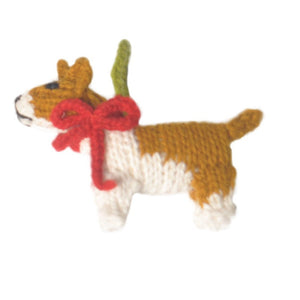 Knitted dog toy with a red bow on a white background