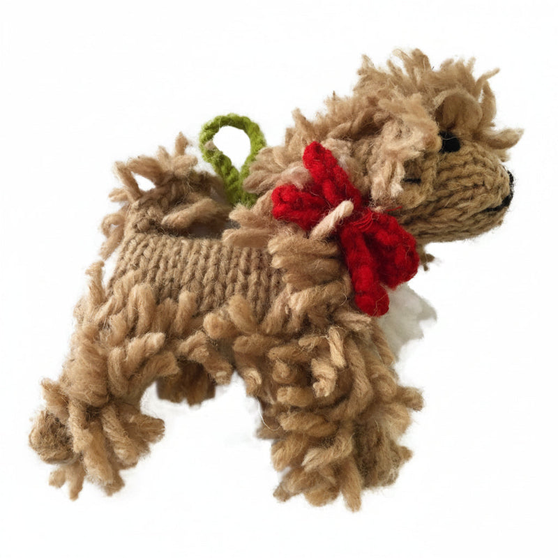 Knitted Dooole ornament with a red bow on a white background