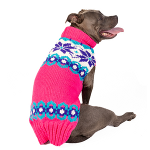 Dog wearing Elsa Dog Sweater with pink purple and turquoise hand-knit pattern