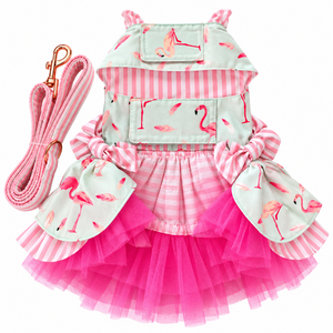 Pink and mint green pet dress-up harness dress with a matching leash, featuring a pink and white striped top, flamingo print fabric panels, and a hot pink tulle skirt.