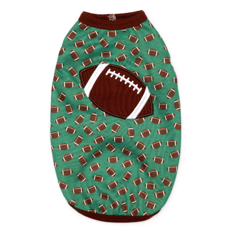 Dog shirt with football pattern on a green background