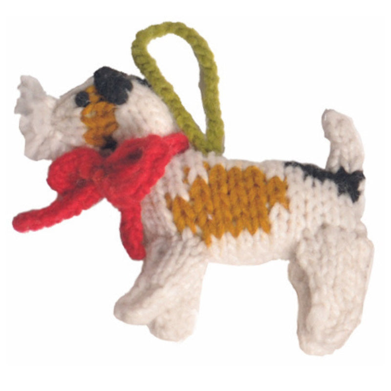 Knitted Fox Terrier ornament with a red scarf and green handle on a white background