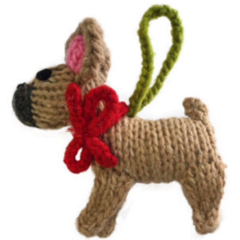 Knitted French Bulldog dog ornament with a red bow and green handle on a white background