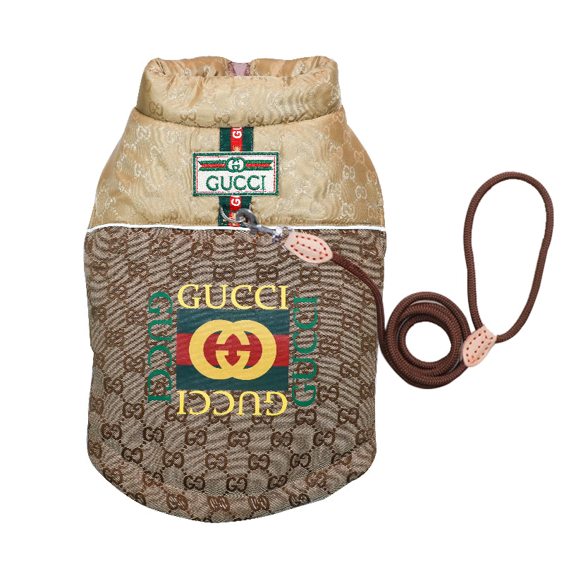 Gucci dog coat brown canvas with beige lining, featuring the classic green and red logo stripes. hown on a white background.