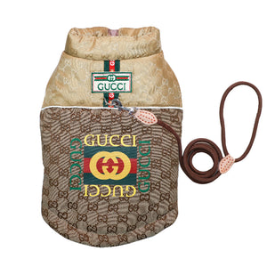 Gucci dog coat brown canvas with beige lining, featuring the classic green and red logo stripes. hown on a white background.