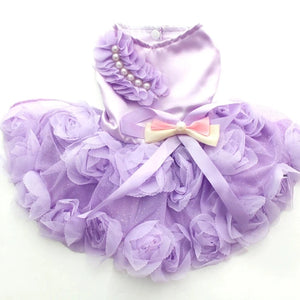 Toy Poodle wearing Elegant Roses Dog Party Dress in pink. has pearl beading across one shoulder