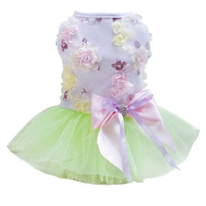 Green Garden Party Dog Dress is adorned with flowers, waistline bow and tulle skirt.