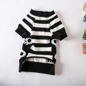 Black and white striped pet sweater on a white background