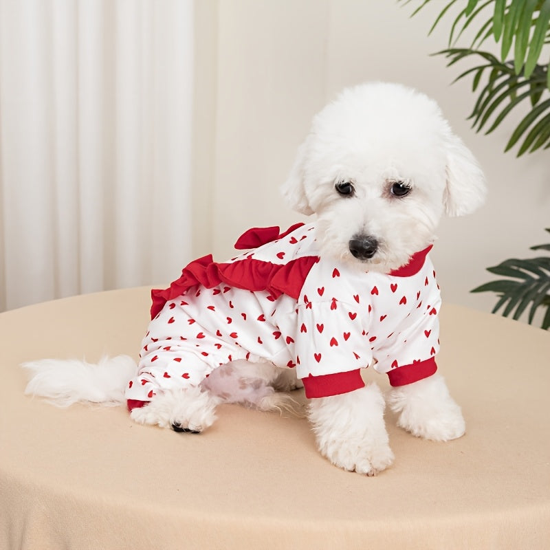 White dog romper with red hearts and bows on a pink background
