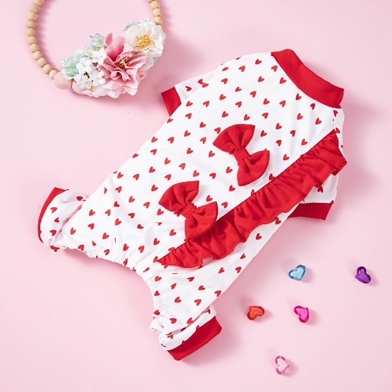 White dog romper with red hearts and bows on a pink background