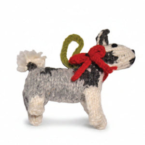 A handmade knitted Husky ornament or figurine with a gray, black, and white pattern, a red bow, and a green hanging loop, shown against a plain white background.