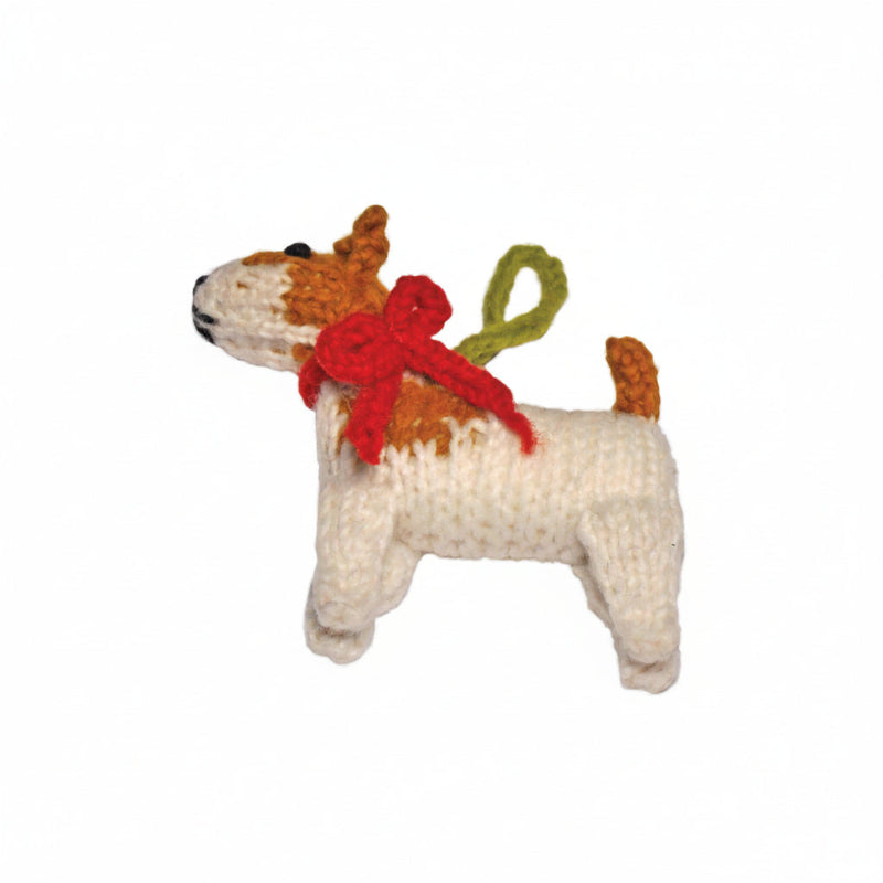 Knitted Jack Russell ornament with a red bow and green antlers on a white background