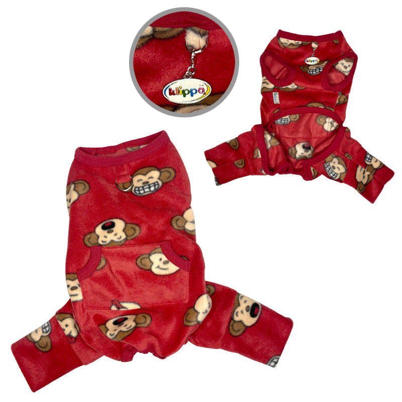Small dog in burgundy fleece pjs with monkey pattern