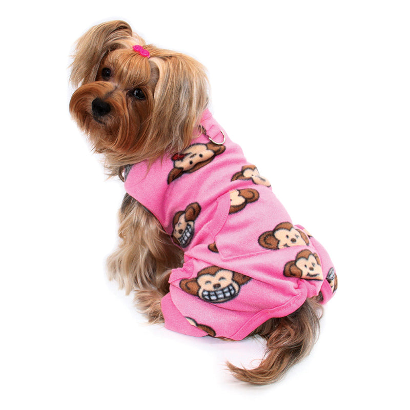 Dog wearing a pink fleece pajamas with monkey patterns 
