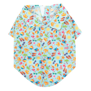 Colorful beach-themed shirt with patterns on a light blue background