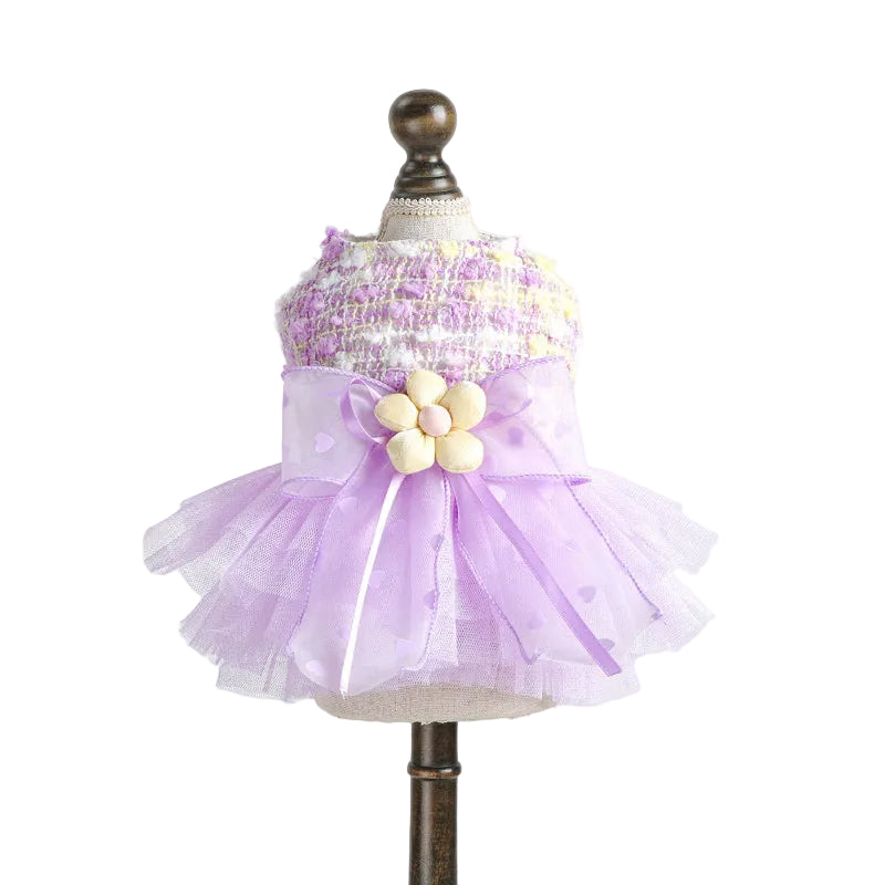 Lilac dog party dress pet  with a floral bow on a mannequin against a white background