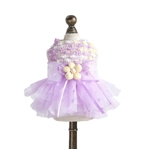 Lilac dog party dress pet  with a floral bow on a mannequin against a white background