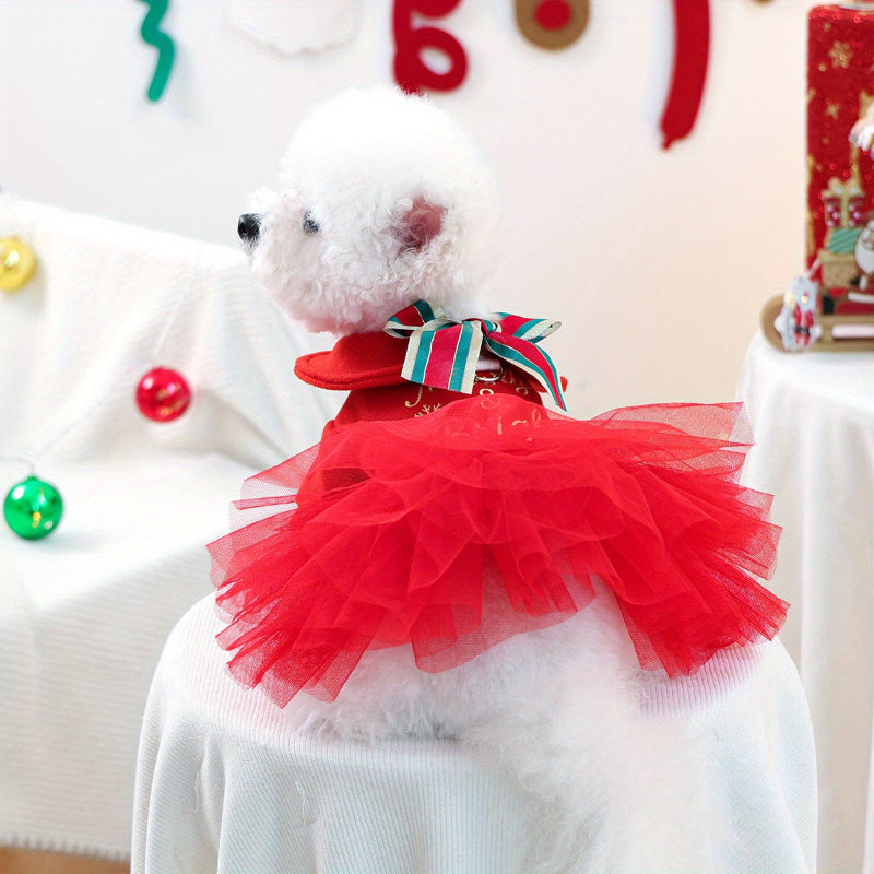 Red Christmas-themed dress with a bow on a wooden mannequin against a festive background.