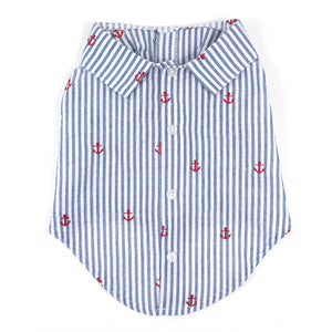 Dog shirt with blue and white striped pattern and red anchor designs on a white background