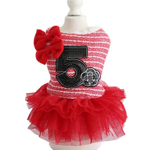 Red and white striped dress with number 5 on a mannequin against a white background