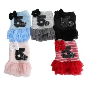 Collection of pet dresses with number '5' design in various colors on a light gray background.