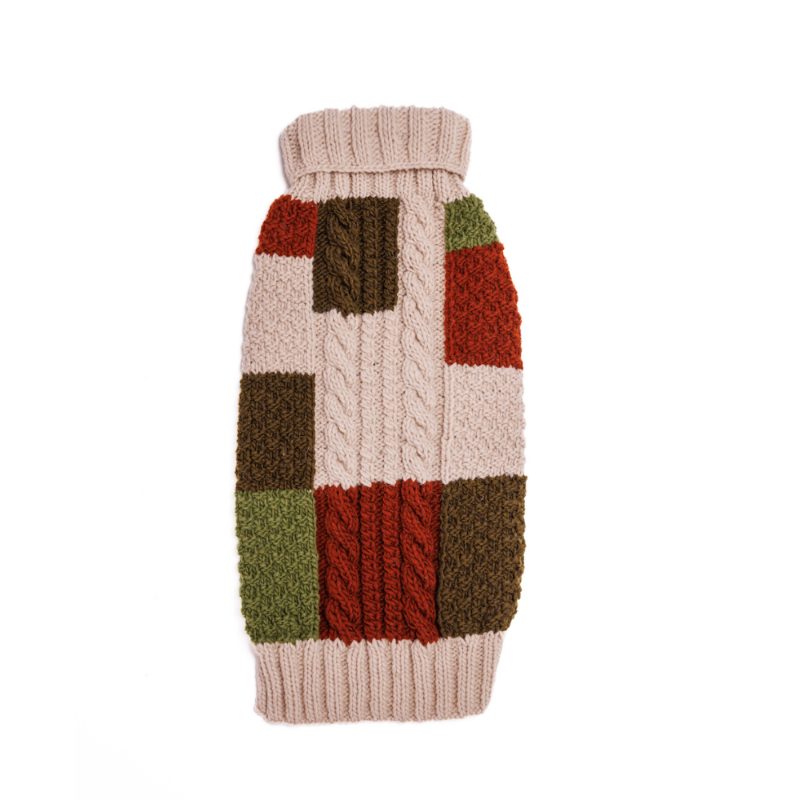 Beagle wearing a colorful knitted sweater on a white background