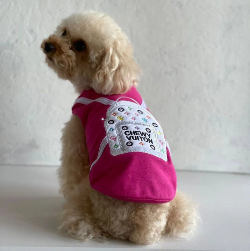 Made of 100% Pima cotton, this designer-inspired embroidered dog T-shirt by Aventura Pups features a Chewy Vuitton white backpack