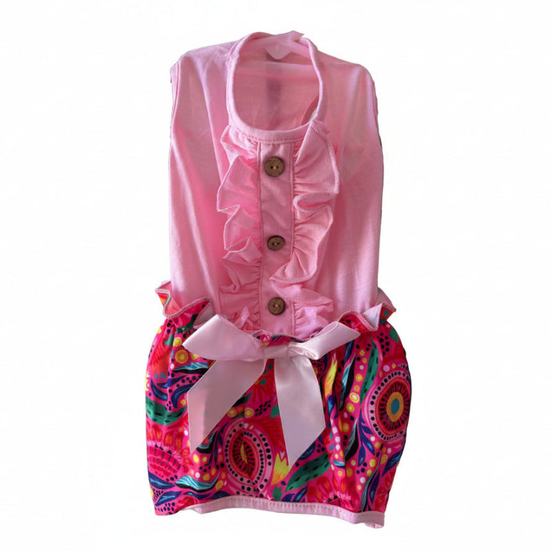 Yorkie wearing Pink ruffle tropical romper